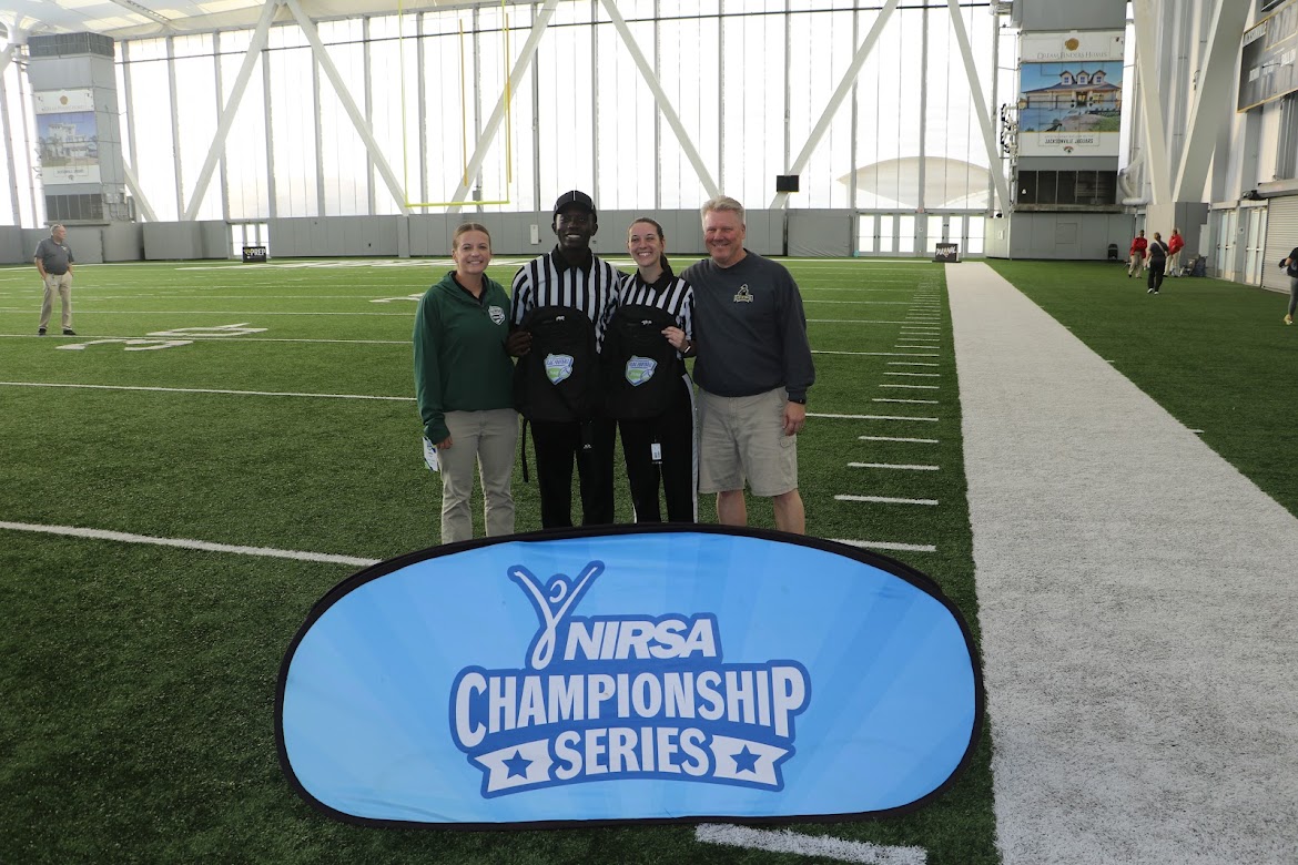 From left to right: Emilee Howard, Brandon Smith, Isabella Price and Jim Wilkening at the NIRSA Flag Football Tournament.